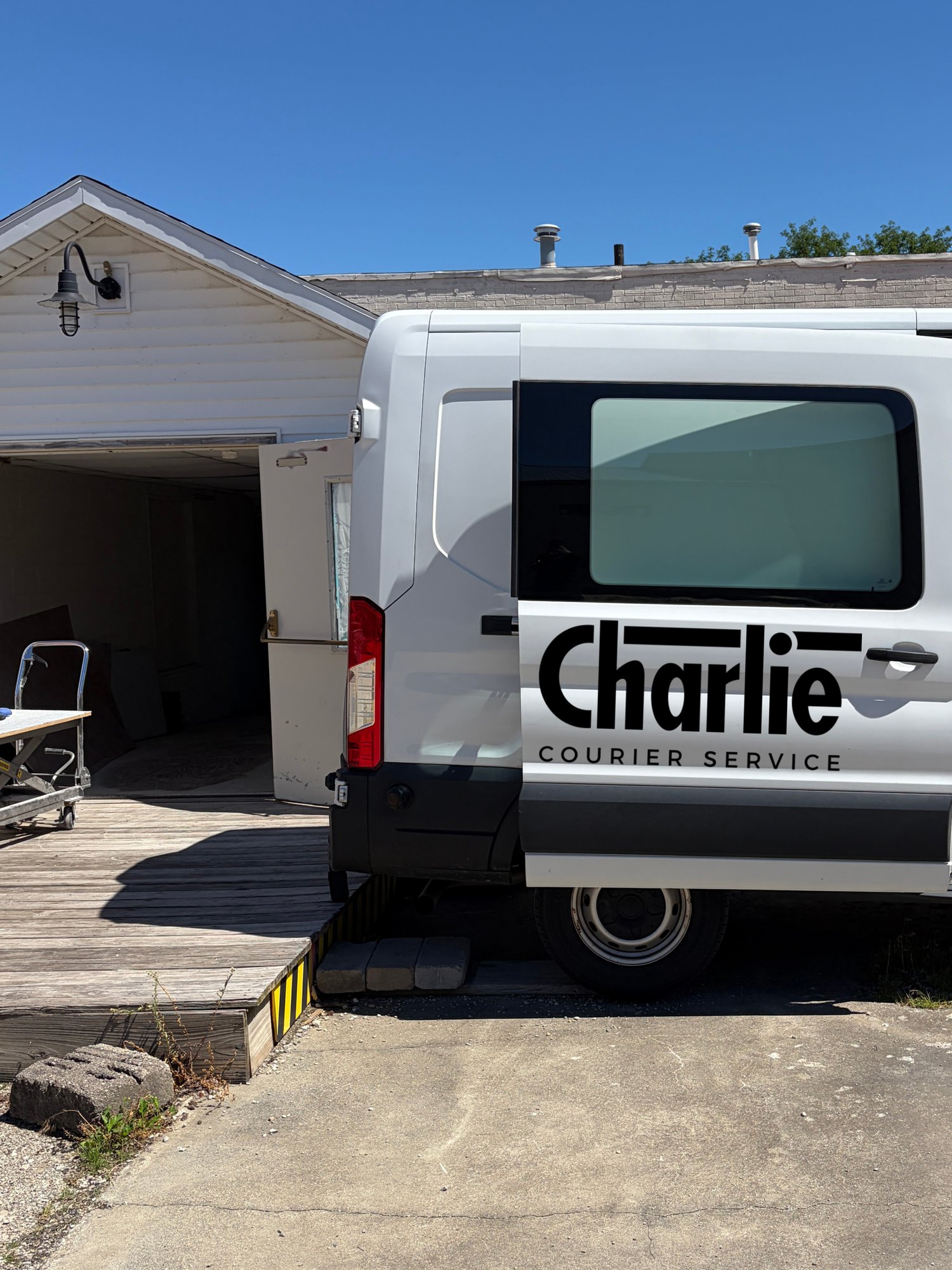 Charlie Courier van making a urgent delivery to a manufacturing facility. 